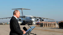 FILE - In this Dec. 12, 2017, file photo, Russian President Vladimir Putin addresses the troops at the Hemeimeem air base in Syria. A summit meeting between the Turkish and Russian leaders scheduled for Thursday, March 5, 2020, may be the last chance to work out a deal that avoids a calamity in Syria's northwest. Faced with mounting losses for his troops in Syria and a potential wave of refugees fleeing fighting in northwestern Syria, Turkish President Recep Tayyip Erdogan is eager for a cease-fire and Vladimir Putin is ready to bargain. (Mikhail Klimentyev/Pool Photo via AP, File)