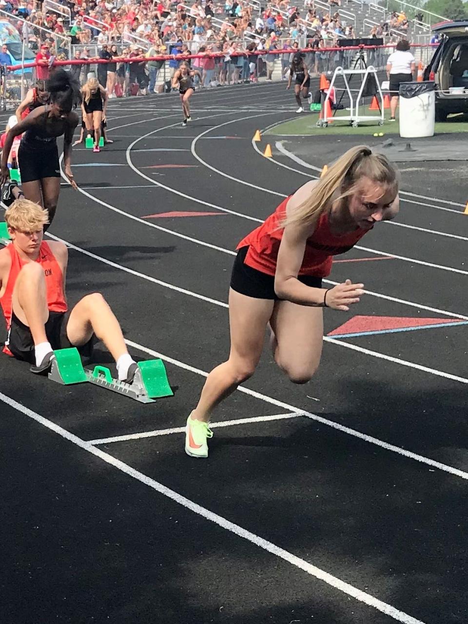 North Union's Hannah Carney fires out of the blocks for a girls 400-meter race at the Division II track and field meet at Westerville South last year.