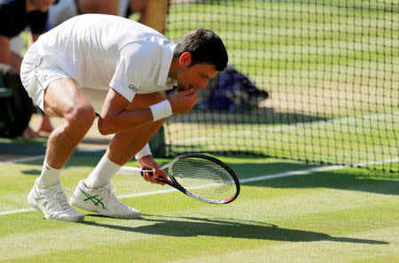 Tennis - Wimbledon - All England Lawn Tennis and Croquet Club, London, Britain - July 15, 2018 Serbia's Novak Djokovic celebrates winning the men's singles final against South Africa's Kevin Anderson. REUTERS/Andrew Couldridge