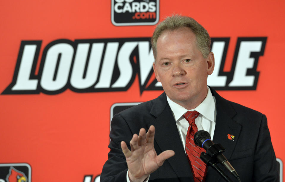 New Louisville NCAA college head football coach Bobby Petrino address reporters following the announcement of his hiring Thursday, Jan. 9, 2014 at Papa John's Cardinal Stadium in Louisville, Ky. (AP Photo/Timothy D. Easley)