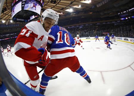 Mar 19, 2019; New York, NY, USA; Detroit Red Wings center Frans Nielsen (51) battles for the puck with New York Rangers defenseman Marc Staal (18) during the first period at Madison Square Garden. Mandatory Credit: Adam Hunger-USA TODAY Sports