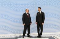 Turkmenistan's President Serdar Berdymukhamedov, right, and Russian President Vladimir Putin pose for a photo on the sidelines of the Caspian Sea littoral states summit in Ashgabat, Turkmenistan, Wednesday, June 29, 2022. (Grigory Sysoyev, Sputnik, Kremlin Pool Photo via AP)