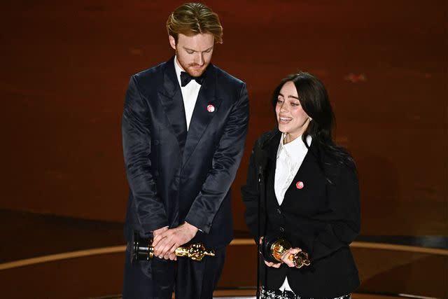 <p>PATRICK T. FALLON/AFP via Getty Images</p> Finneas O'Connell and Billie Eilish at 2024 Oscars