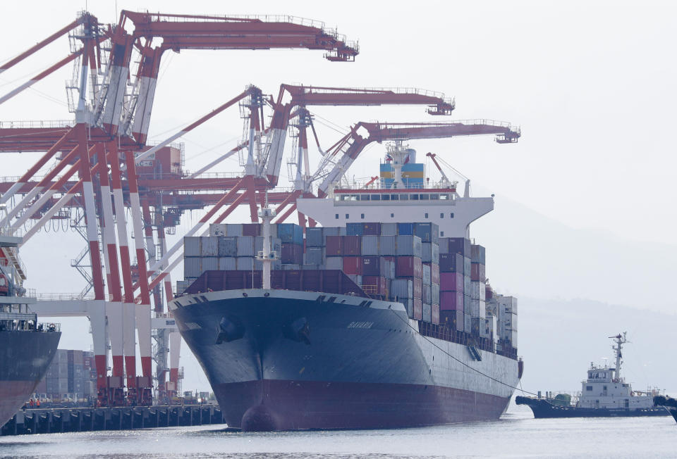 Cargo ship M/V Bavaria prepares to dock at Subic port in Zambales province, northwestern Philippines on Thursday, May 30, 2019. A Philippine official says a cargo ship has arrived in a northern port to pick up and return 69 containers of Canadian garbage which the government in Manila says was shipped illegally to the Philippines years ago. (AP Photo/Aaron Favila)