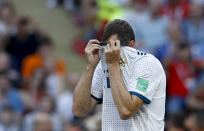 <p>Russia’s Artyom Dzyuba shows his dismay as Sergio Ramos celebrates putting Spain ahead </p>
