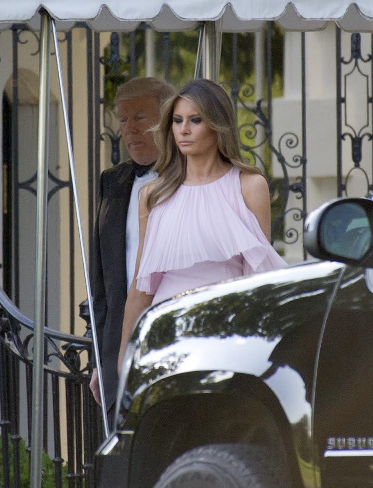 <em>First lady escorted by her husband. [Photo: Getty]</em>