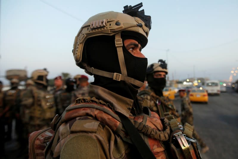 FILE PHOTO: Members of Iraqi security forces are seen during the ongoing anti-government protests in Basra