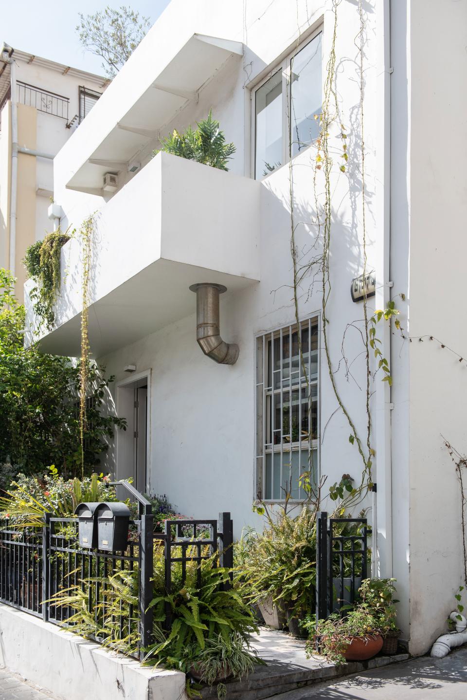 A look at the building’s Bauhaus façade—a bright splash of geometric white on an unassuming side street, a skip away from Tel Aviv’s famed Carmel Market.