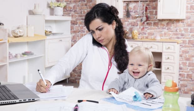 Mother and baby in home office