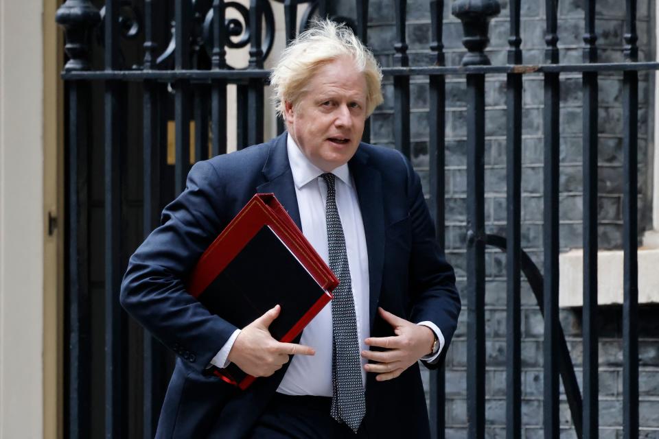 Britain's Prime Minister Boris Johnson walks from 10 Downing Street to the press briefing room at 9 Downing Street to chair an emergency meeting with G7 counterparts over the Afghanistan crisis in central London on August 24, 2021. - The UK was set to chair the emergency talks among the G7 group of wealthy countries on August 24, and has said it will urge the United States to extend the end-of-the-month deadline to complete the Afghan airlifts. (Photo by Tolga Akmen / AFP) (Photo by TOLGA AKMEN/AFP via Getty Images)