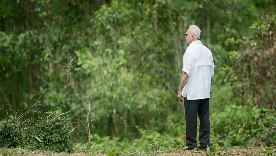 In an image provided by ESPN from video, Rocky Bleier stands in Hiep Duc Valley, about 35 miles (56 kilometers) south of Danang in Vietnam, on Aug. 20, 2018. Three months into his deployment to Vietnam, Bleier was shot through the thigh and suffered a grenade blast to his foot. Doctors told him that he’d never play football again. Steelers owner Art Rooney supported Bleier by placing him on injured reserve rather than cutting him from the team. Bleier then defied the odds, returning to football as a star running back on the “Steel Curtain” Steelers teams of the 1970s and becoming the only war veteran to have four Super Bowl rings. (ESPN via AP)