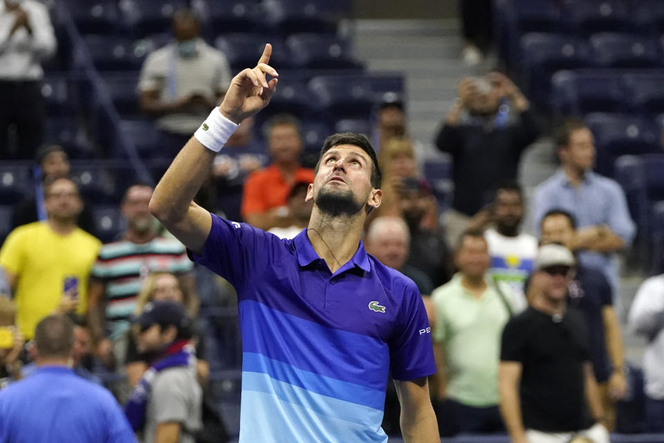 Novak Djokovic, of Serbia, motions and looks up after defeating Matteo Berrettini, of Italy, during the quarterfinals of the U.S. Open tennis tournament Thursday, Sept. 9, 2021, in New York. (AP Photo/Frank Franklin II)