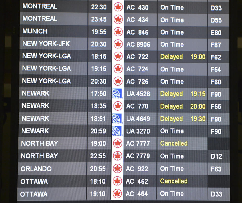 TORONTO, ON - DECEMBER 26: '12-12-26 - TORONTO, ONTARIO - The departure board at T1 shows some delays and two cancelled flights. Some passengers are stranded in Toronto as they try to make their way to New York City. After two delays, WestJet finally cancelled Flight 1206 to La Guardia Airport. East coast city's like New York, Newark, Philladelphia and Washington all showed "cancelled" flights at Toronto's Pearson International Airport, on Wednesday December 26, 2012.  (RICK MADONIK/TORONTO STAR)        (Rick Madonik/Toronto Star via Getty Images)