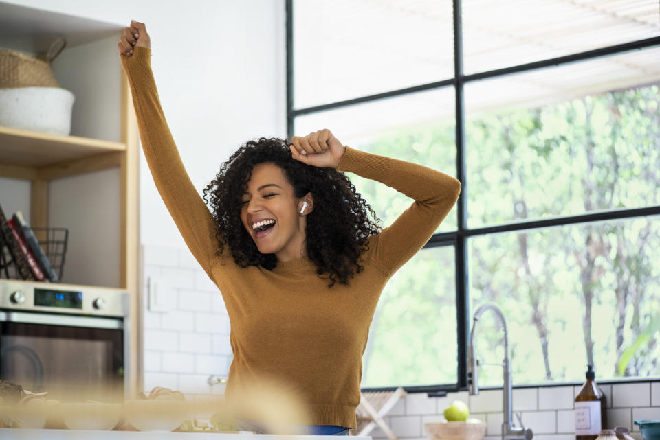 A woman dancing in the kitchen