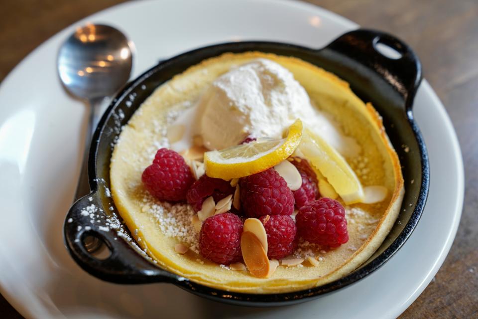 Dutch baby with raspberries, whipped cream and almonds at Fado Pub & Kitchen in Dublin's Bridge Park.