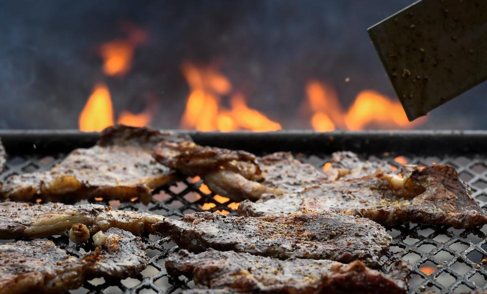 Ribeye steaks on the grill at the 2019 Tri-Fest in downtown Henderson.