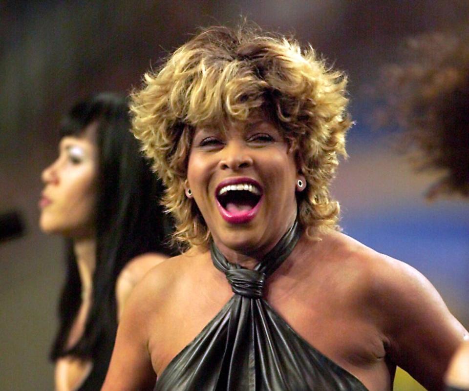 Tina Turner, seen here performing during the pre-game show prior to Super Bowl XXXIV in 2000, has died at 83.