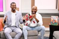 Karamo Brown and son Jason Brown are all smiles during a visit to <em>People Now</em> to promote their new book <em>I Am Perfectly Designed</em> at the PeopleTV Studios on Wednesday in N.Y.C.