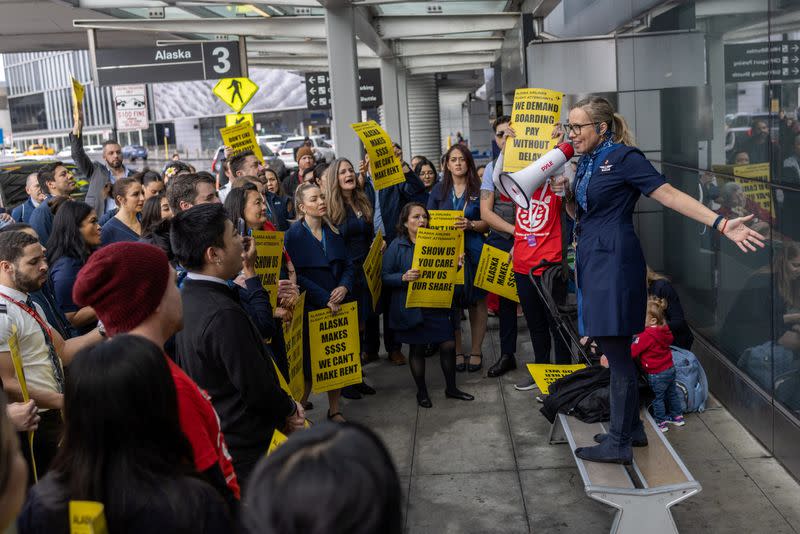 FILE PHOTO: Alaska Airlines flight attendants protest at San Francisco airport to push for landmark changes in new contracts