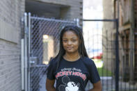 In this Sept. 26, 2021, photo Telia, 13, poses for a portrait in Chicago. She was 11 years old when on two occasions, just 11 weeks apart, police kicked open the front door of her home on Chicago's South Side and ordered Telia and her siblings to get down on the floor. (AP Photo/Teresa Crawford)