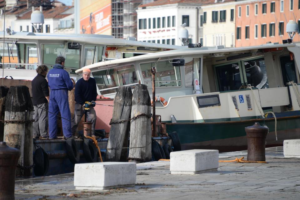 People work to fix damages following a flooding in Venice, Italy, Thursday, Nov. 14, 2019. The worst flooding in Venice in more than 50 years has prompted calls to better protect the historic city from rising sea levels as officials calculated hundreds of millions of euros in damage. The water reached 1.87 meters above sea level Tuesday, the second-highest level ever recorded in the city. (Andrea Merola/ANSA via AP)