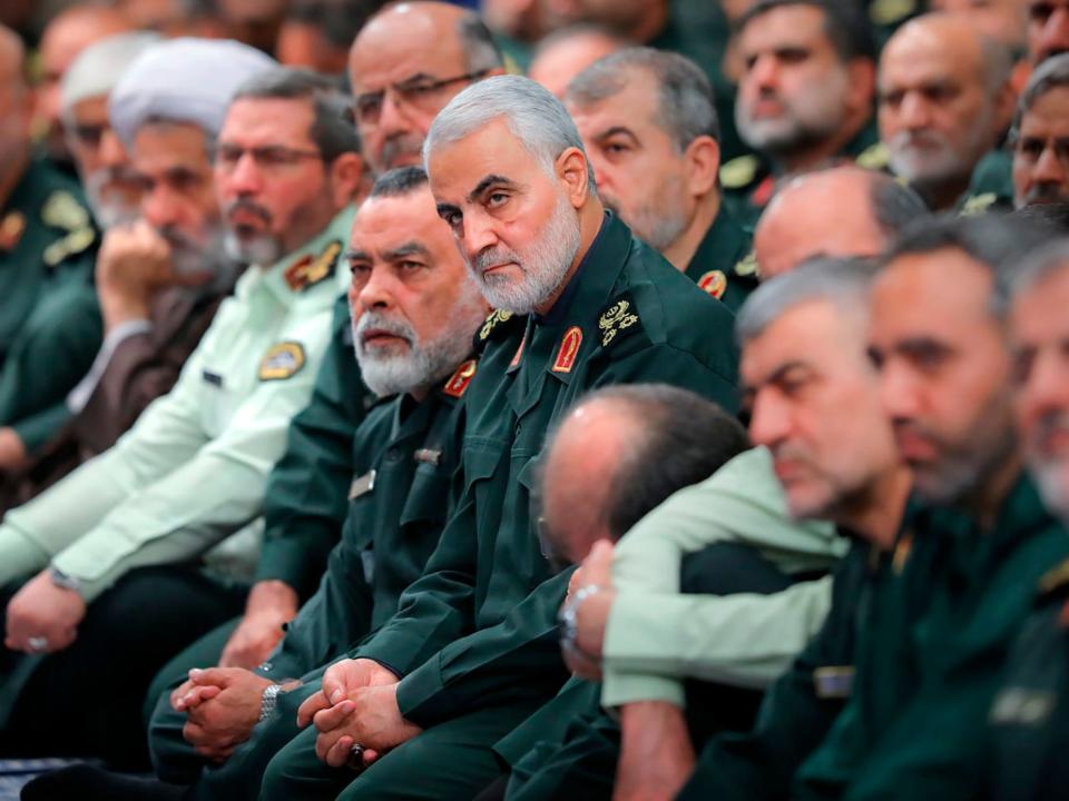 The head of the Revolutionary Guard's foreign wing, or Quds Force, Gen. Qassim Soleimani, center, attends a meeting of a group of the Guard members