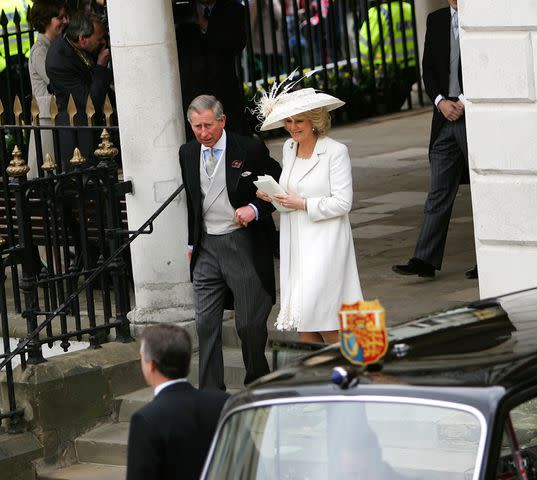 <p>Dean Mouhtaropoulos/Getty </p> Prince Charles and Camilla, Duchess of Cornwall leave the civil ceremony where they were legally married at The Guildhall, Windsor on April 9, 2005.