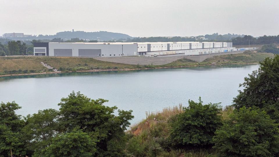 Looking across a former quarry, now-filled with water, the 483,770 square-foot industrial property at 405 Busser, near Emigsvllle, was leased to Hill's Pet Nutrition. Several other warehouses, already under construction, will eventually surround the quarry.