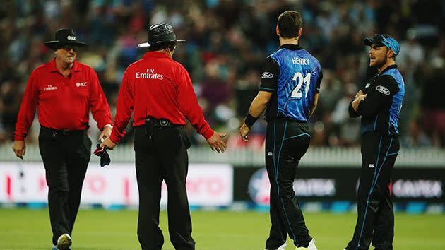 Umpires talk to the Kiwis. Image: Getty