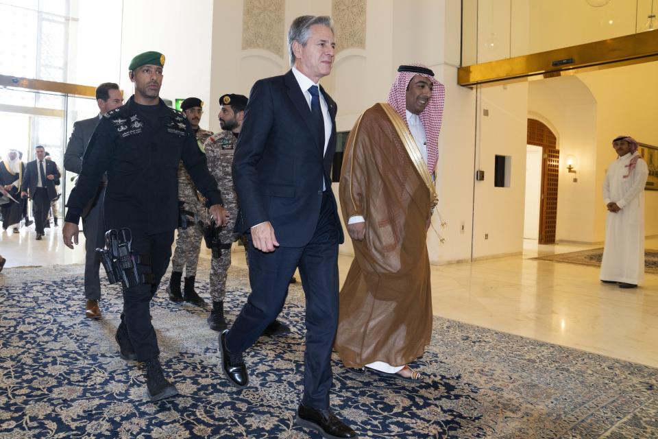U.S. Secretary of State Antony Blinken, center, arrives to meet with Saudi Foreign Minister Prince Faisal bin Farhan, at the Ministry of Foreign Affairs in Riyadh, Saudi Arabia, Saturday Oct. 14, 2023. (AP Photo/Jacquelyn Martin, Pool)