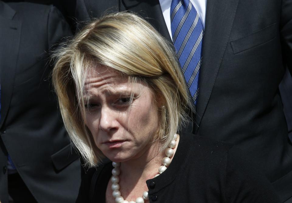 New Jersey Governor Chris Christie's former deputy chief of staff Bridget Anne Kelly stands outside Mercer County Criminal Court in Trenton, New Jersey March 11, 2014. A New Jersey Superior Court judge heard arguments on Tuesday about whether Kelly and Christie's former campaign manager, Bill Stepien, have to turn over documents to a New Jersey state legislative committee investigating the September 2013 lane closures on the George Washington bridge. (REUTERS/Mike Segar)