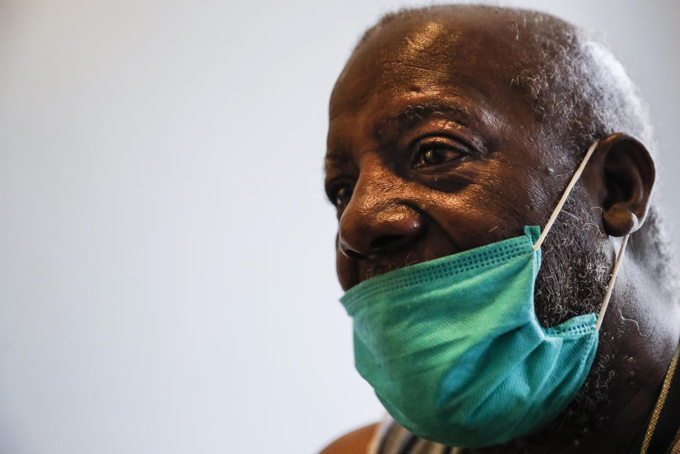 Eugene, 67, waits in his room at Eastern Parkway Residences to receive an injection of antipsychotic medication for his schizophrenia from Dr. Jeanie Tse, chief medical officer at the Institute for Community Living, Wednesday, May 6, 2020, in the Brooklyn borough of New York. (AP Photo/John Minchillo)