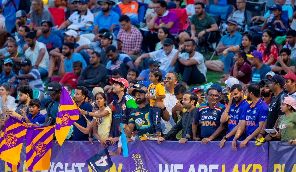 Fans crowd around the boundary of the of the oval field to watch a Major League Cricket match between the Washington Freedom and the LA Knight Riders on Thursday, July 20, 2023 at Church Street Park in Morrisville, N.C.