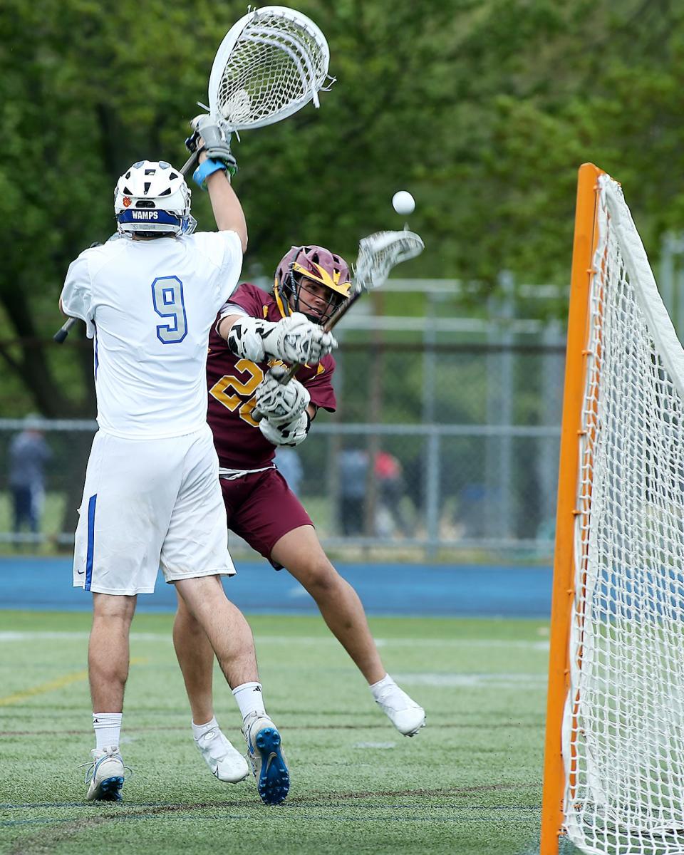 Weymouth's Mike Stevenson eludes Braintree goalie Colin Gaffney to give Weymouth the 2-0 lead during first quarter action of their game at Braintree High on Tuesday, May 17, 2022.