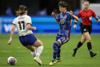 United States' Sam Coffey (17) and Japan's Aoba Fujino (15) battle for the ball in the first half of the SheBelieves Cup women’s soccer tournament, Saturday, April 6, 2024, in Atlanta. (AP Photo/Mike Stewart)