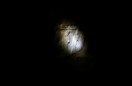 Artefacts and archaeological pieces are seen in a tunnel network running under the Mosque of Prophet Jonah, Nabi Yunus in Arabic, in eastern Mosul, Iraq March 9, 2017. Picture taken March 9, 2017. REUTERS/Suhaib Salem