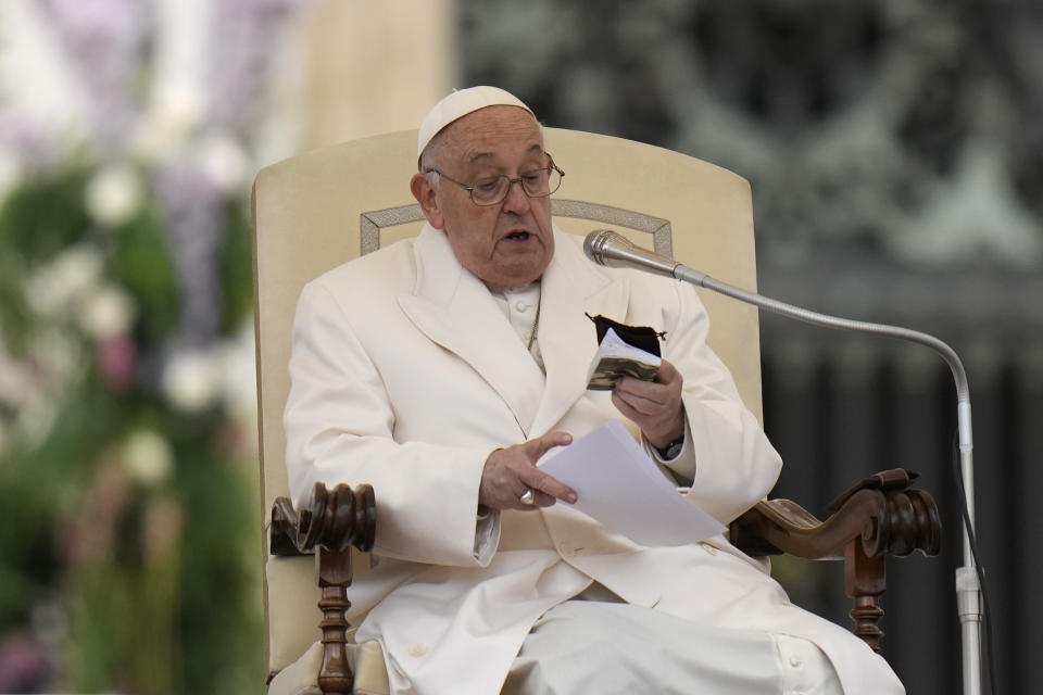 Pope Francis holds his weekly general audience in St. Peter's Square, at the Vatican, Wednesday, April 3, 2024. Pope Francis showed tourists and pilgrims the rosary and Gospel booklet that the 23-year-old Ukrainian Alexander had with him when he was killed in Russia's war.(AP Photo/Alessandra Tarantino)