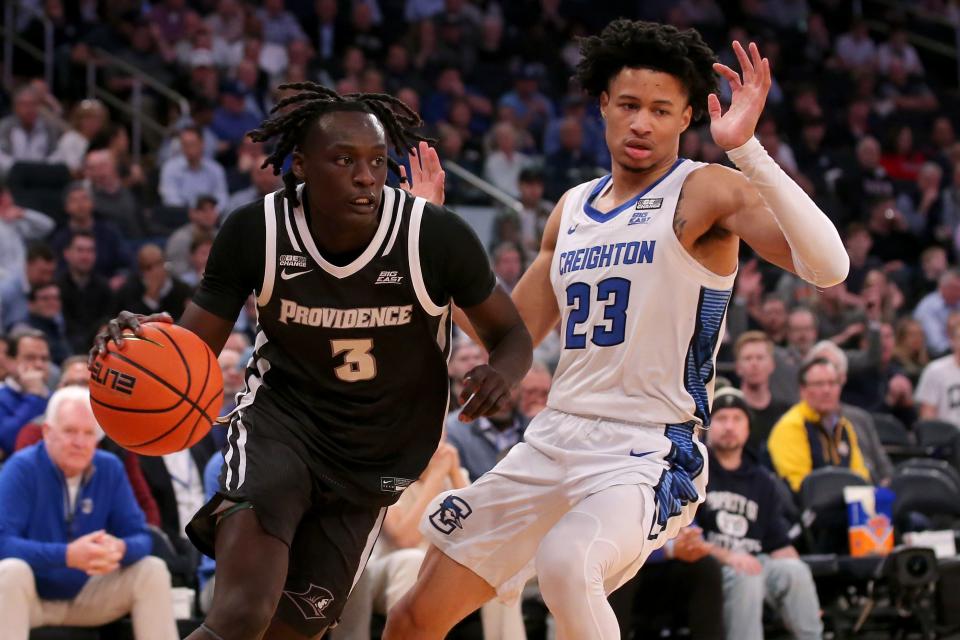 Mar 14, 2024; New York City, NY, USA; Providence Friars guard Garwey Dual (3) controls the ball against Creighton Bluejays guard Trey Alexander (23) during the first half at Madison Square Garden.