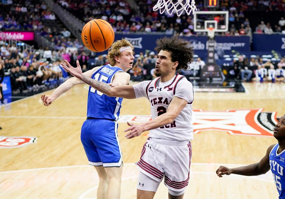 Pop Isaacs #2 of Texas Tech loses control of the ball against Richie Saunders #15 of BYU during the second half of a quarterfinal game of the Big 12 Men's Basketball Tournament at T-Mobile Center on Thursday, March 14, 2024 in Kansas City, Missouri.