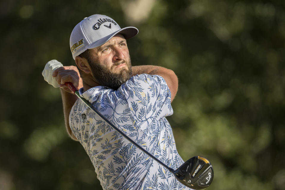 Jon Rahm, of Spain, watches his drive off the 12th tee during the third round of the CJ Cup golf tournament Saturday, Oct. 22, 2022, in Ridgeland, S.C. (AP Photo/Stephen B. Morton)