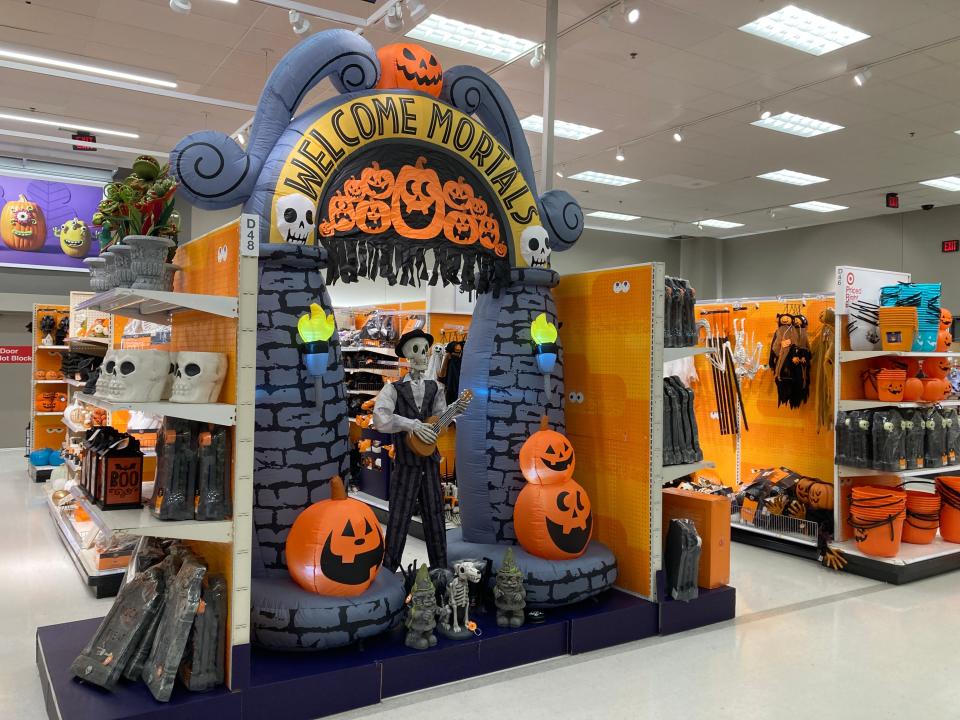 Target's Halloween section with a display that says "Welcome mortals" with a skeleton holding a ukulele.