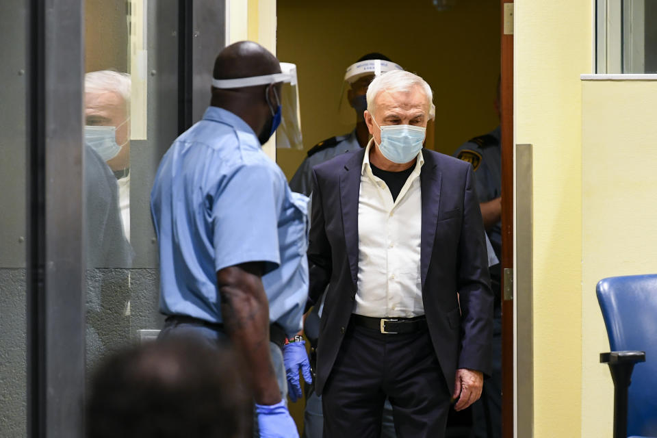 Former head of Serbia's state security service Jovica Stanisic appears in court at the UN International Residual Mechanism for Criminal Tribunals (IRMCT) in The Hague, Netherlands, Wednesday June 30, 2021. A UN court is delivering judgments in the retrial of Jovica Stanisic and Franko Simatovic, accused of organizing, arming and supporting Serb paramilitaries that committed atrocities in Croatia and Bosnia as Yugoslavia crumbled in the early 1990s. (Piroschka van de Wouw/Pool via AP)