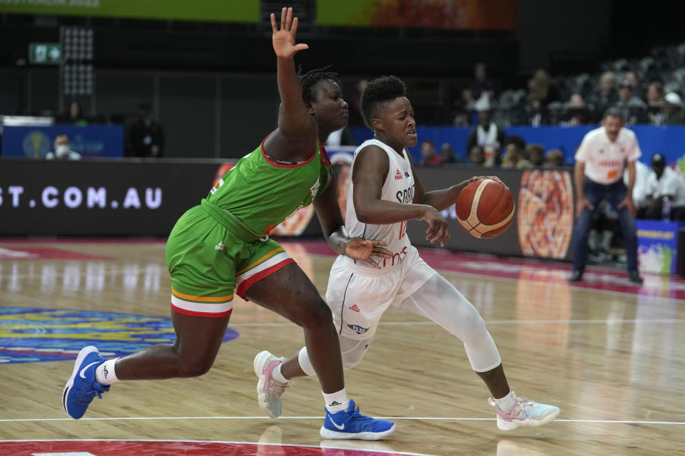 Serbia's Yvonne Anderson, right, goes around Mali's Kamite Elizabeth Dabou during their game at the women's Basketball World Cup in Sydney, Australia, Monday, Sept. 26, 2022. (AP Photo/Rick Rycroft)