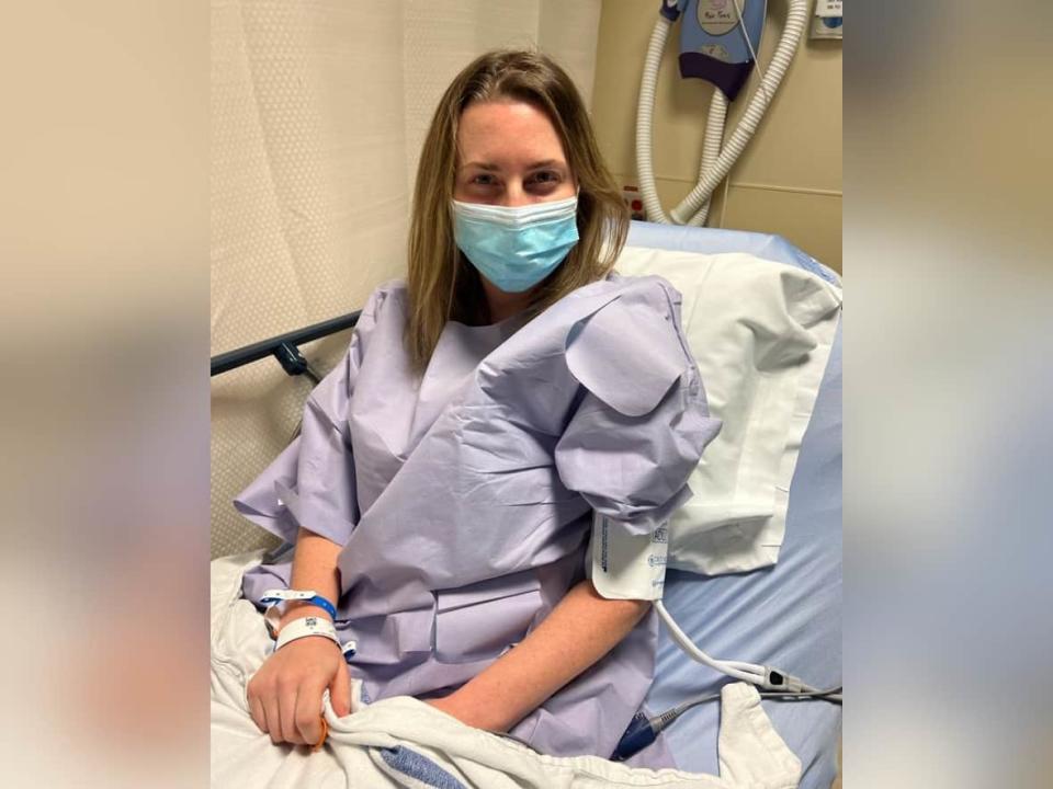 Prince George, B.C., lawyer Carolynne Burkholder-James is pictured on her bed before kidney removal surgery at the Vancouver General Hospital on Dec. 1, 2022. (Submitted by Carolynne Burkholder-James - image credit)