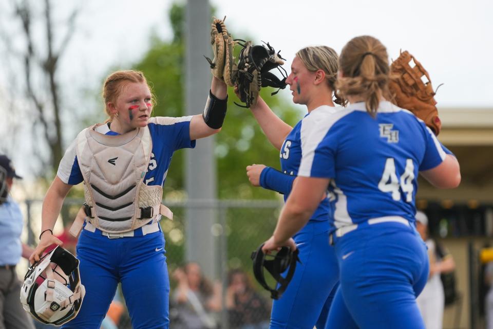 Eastern Hancock Royals Camryn Blue (5) high fives Eastern Hancock Royals McKenna Stewart (11) after making the final out of the inning against the Lapel High School Bulldogs on Friday, May 3, 2024, during the varsity girls softball game at Lapel High School in Lapel, Indiana. The Eastern Hancock Royals defeated the Lapel High School Bulldogs 2-1.