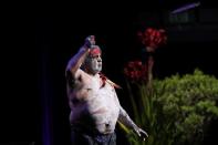 An aboriginal dancer performs at a state memorial honouring victims of the Australian bushfires in Sydney