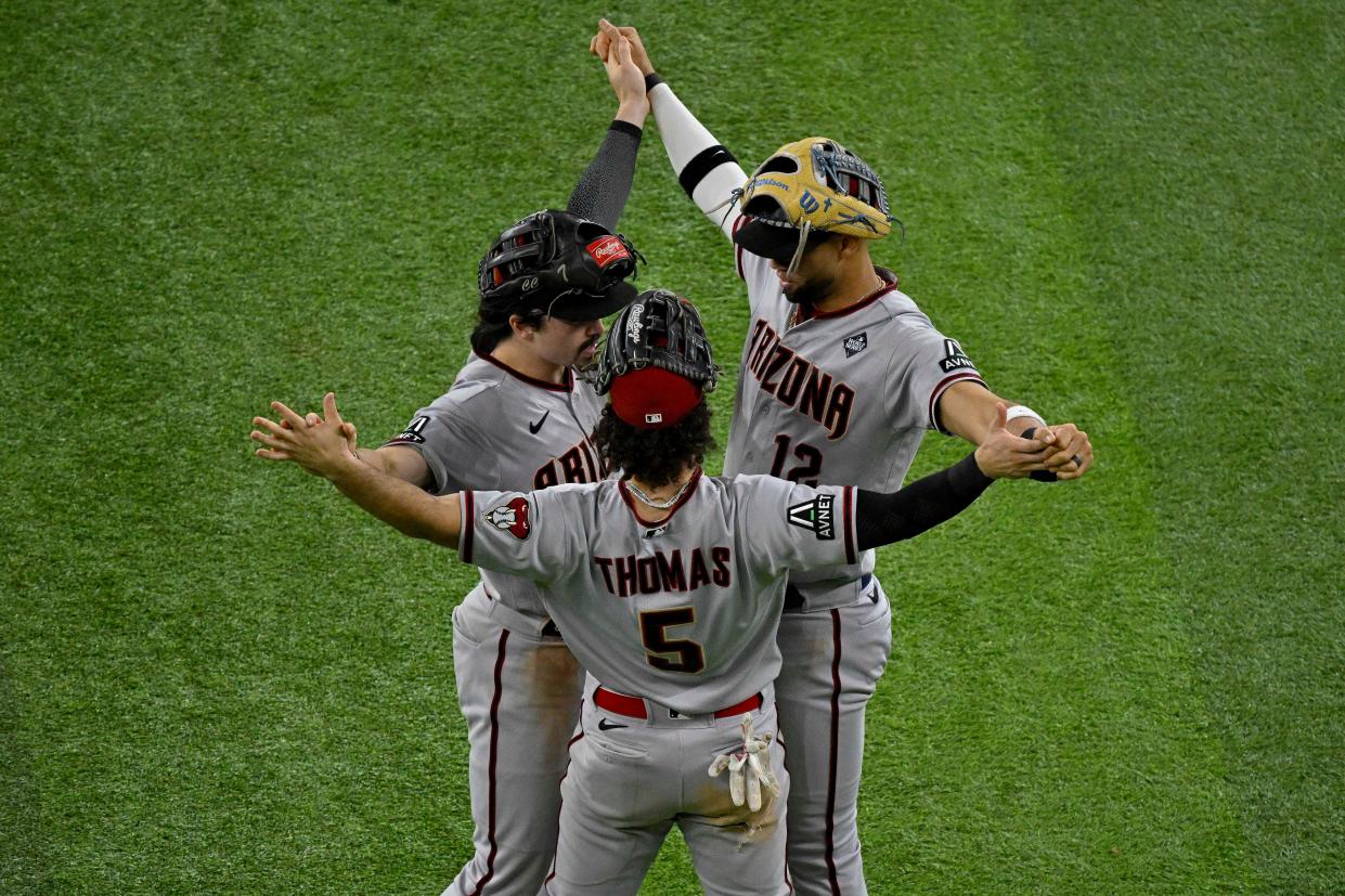 Game 2: Diamondbacks outfielders Corbin Carroll, Alek Thomas and Lourdes Gurriel Jr. celebrate the victory over the Rangers.