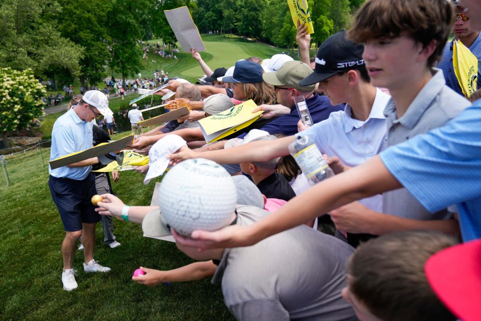 May 31, 2023; Dublin, Ohio, USA;  Peyton Manning signs hundreds of autographs as he leaves the ninth hole during the Workday Golden Bear Pro Am at the Memorial Tournament at Muirlfield Village Golf Club.