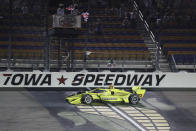 Simon Pagenaud, of France, crosses the finish line as he wins an IndyCar Series auto race Friday, July 17, 2020, at Iowa Speedway in Newton, Iowa. (AP Photo/Charlie Neibergall)