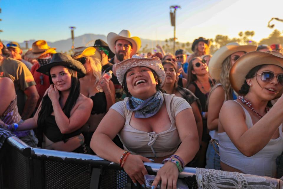 Fans in cowboy hats.